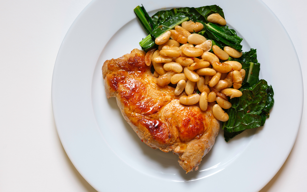 Pan-seared,Pork,With,White,Beans,,Kale,,And,Garlic,Served,On,Protein,Diet,Food,Nutririon