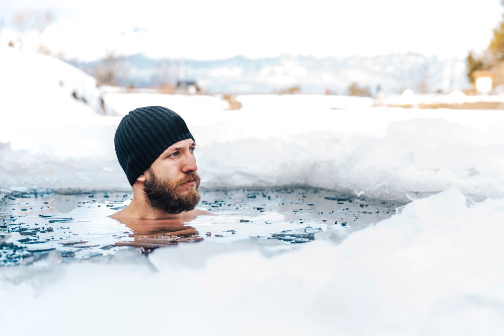 Young,Man,With,Beard,Swims,In,The,Winter,Lake.,Winter