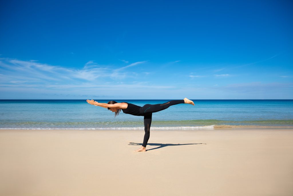Healthy,Ashtanga,Yoga,Exercise,On,The,Beach,,Slim,Sporty,Body