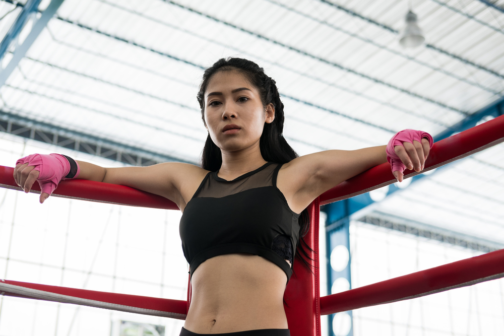 Young,Woman,Prepare,For,Exercise,In,Fitness,Center.,Female,Boxer